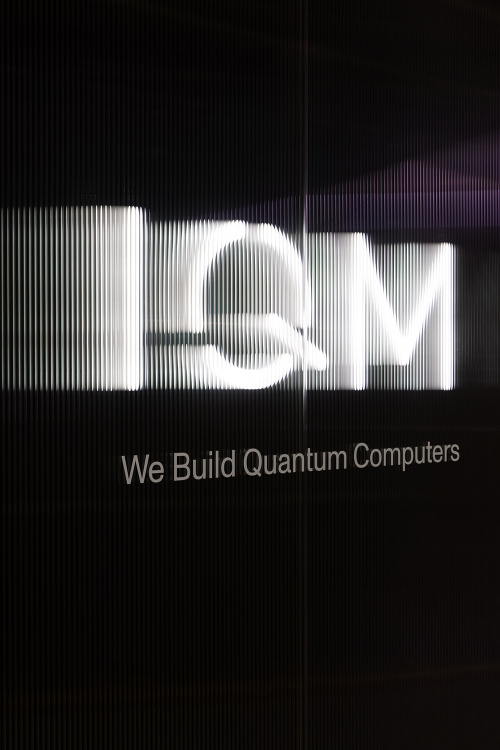 IQM quantum computer showroom design event space light logo optical illusion